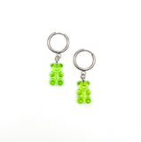Two green gummy bear keychains on a white background