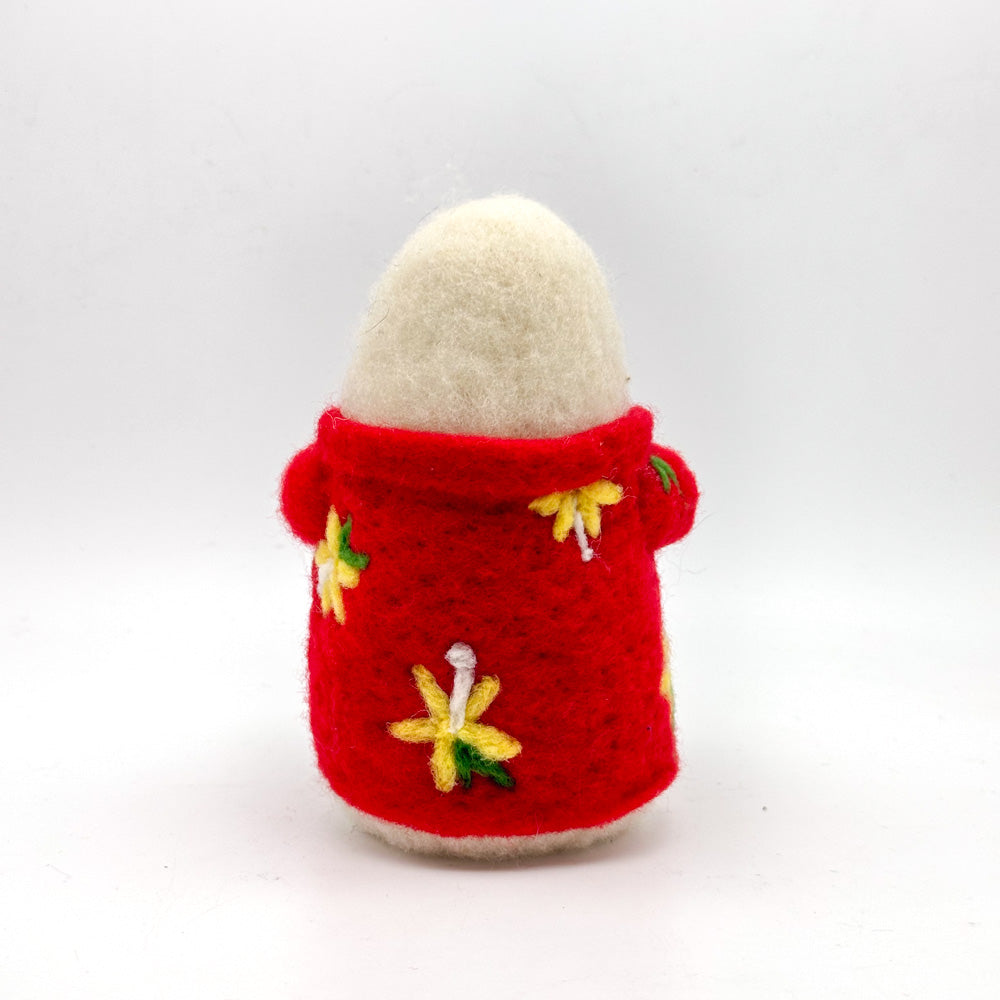 Image from the back of a hand felted small white ghost in a red Hawaiian style shirt holding a coconut cocktail